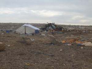 Humanitarian Tent next to Remains of Rasha's Home Photo Credit: G Le Gauyer